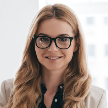 smiling young businesswoman wearing glasses