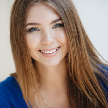 cheerful young woman with a snow-white smile